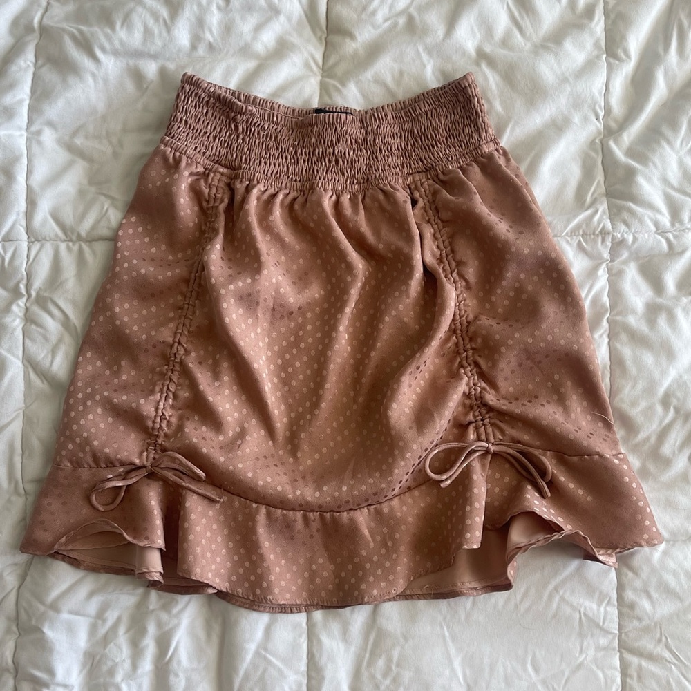 Pink ruched mini skirt
